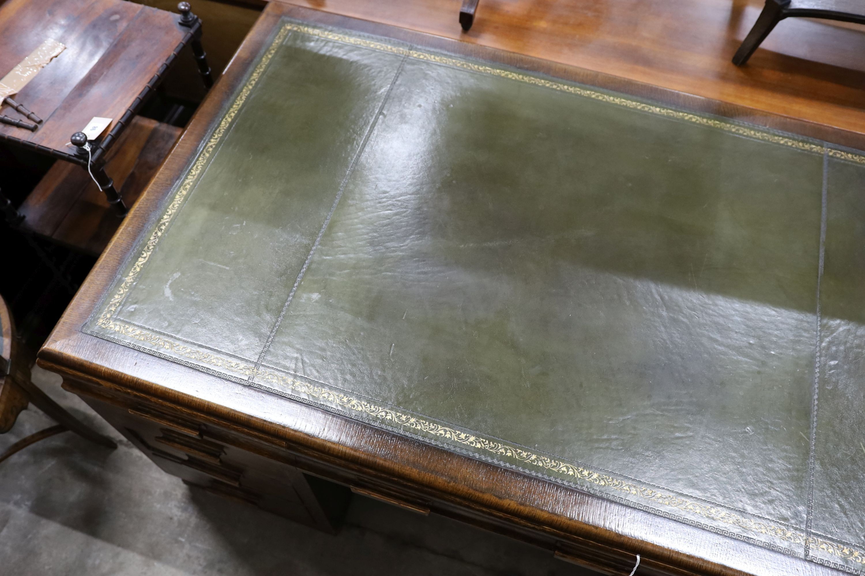 An early 20th century oak pedestal desk, length 152cm, depth 90cm, height 78cm